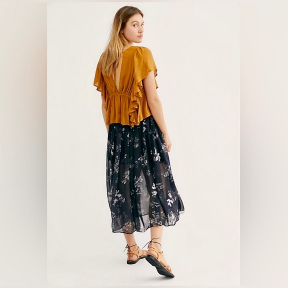 Free people Lydia skirt. Black and white floral with black solid under skirt. - Picture 1 of 10